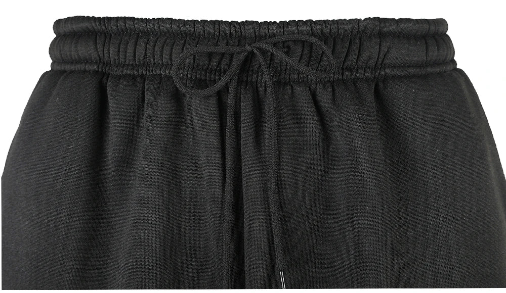 Pantalon de gym homme en noir avec taille élastique et cordon de serrage pour un confort optimal